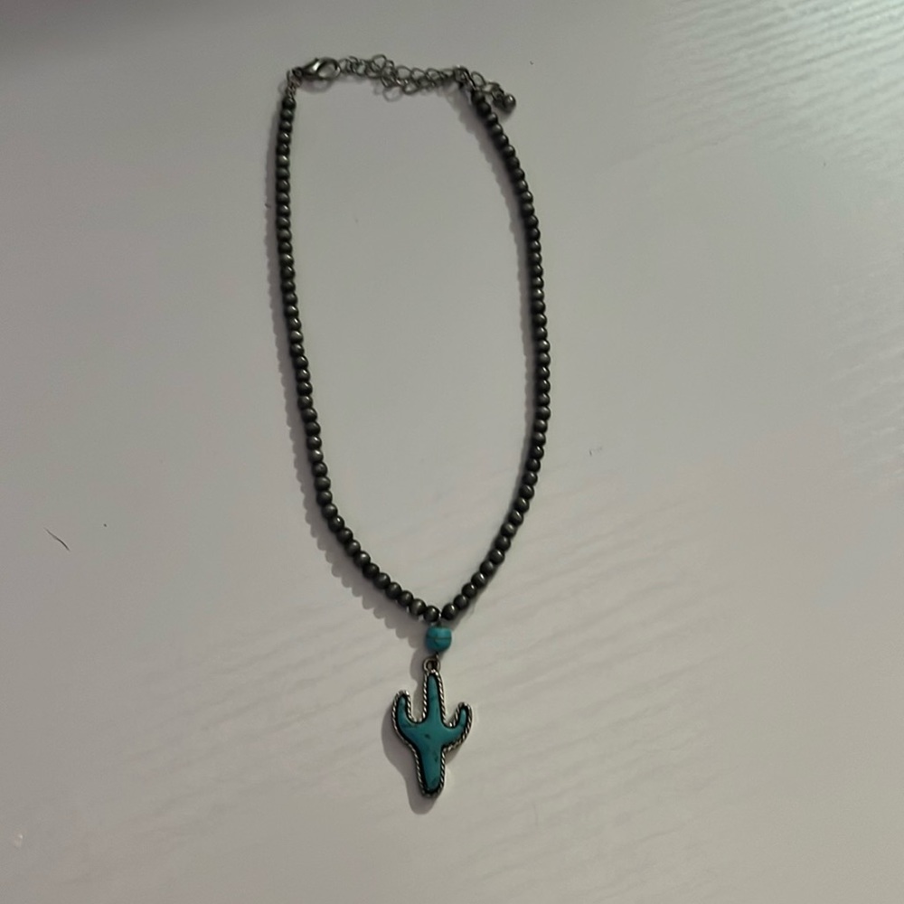Cactus necklace, from a boutique, nevermore.